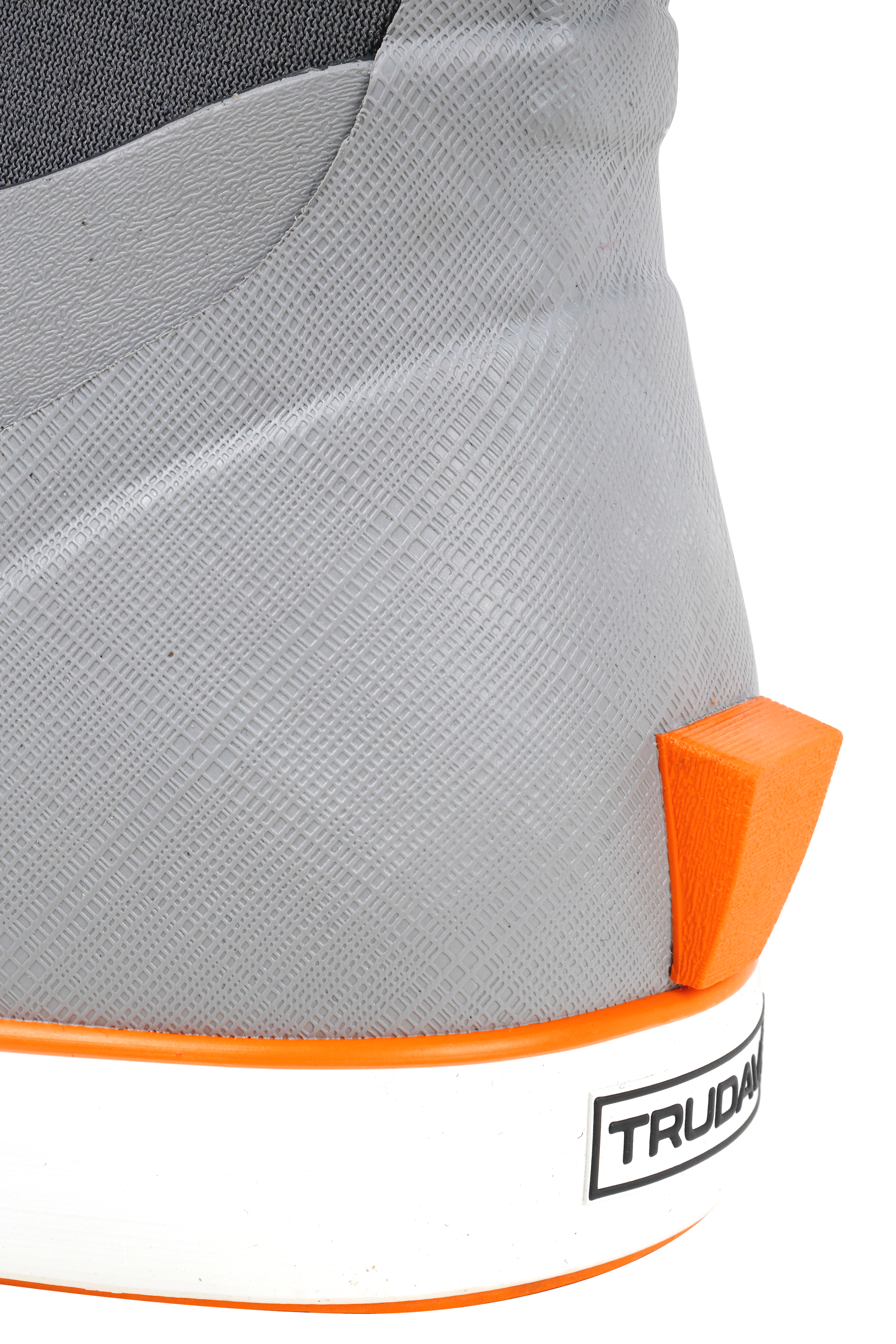 alt="Close-up of the heel area on Trudave Seafarer Lite Series men’s waterproof slip-on ankle deck boots in gray color showing small rear kick lug for easy removal, reinforced heel structure, and non-slip waterproof rubber sole designed for fishing and marine deck use"
